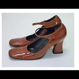 Prada burnt orange patent leather pumps